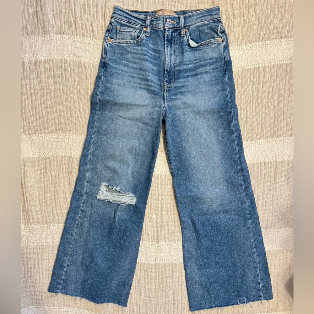 7 For All Mankind Luxe Vintage wide-leg, high-rise jeans with a distressed hem